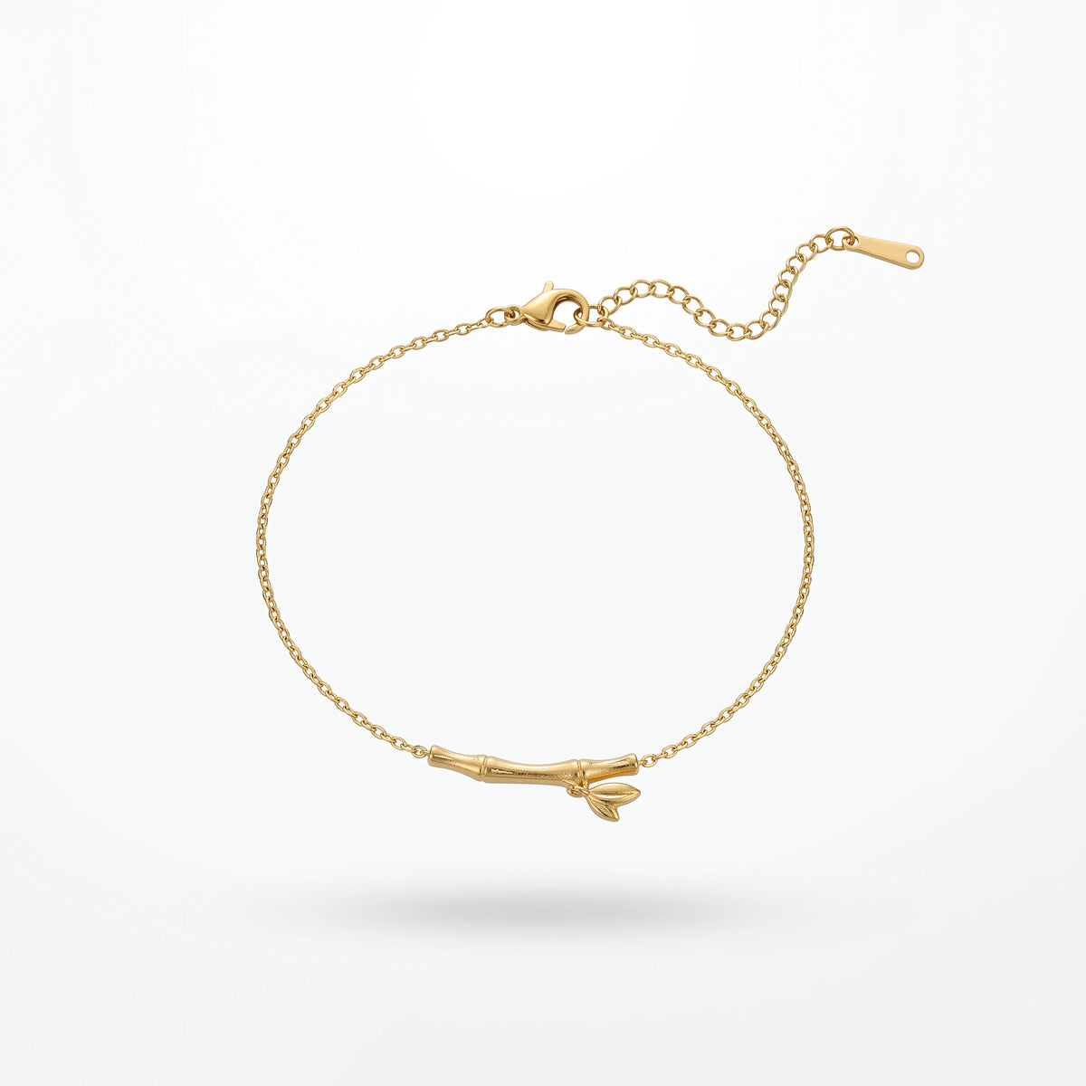 QIAOREN 13769 Thin Oval Link Adjustable Anklet with Matte Textured Bamboo Bar Charm with Tiny Leaf Detail